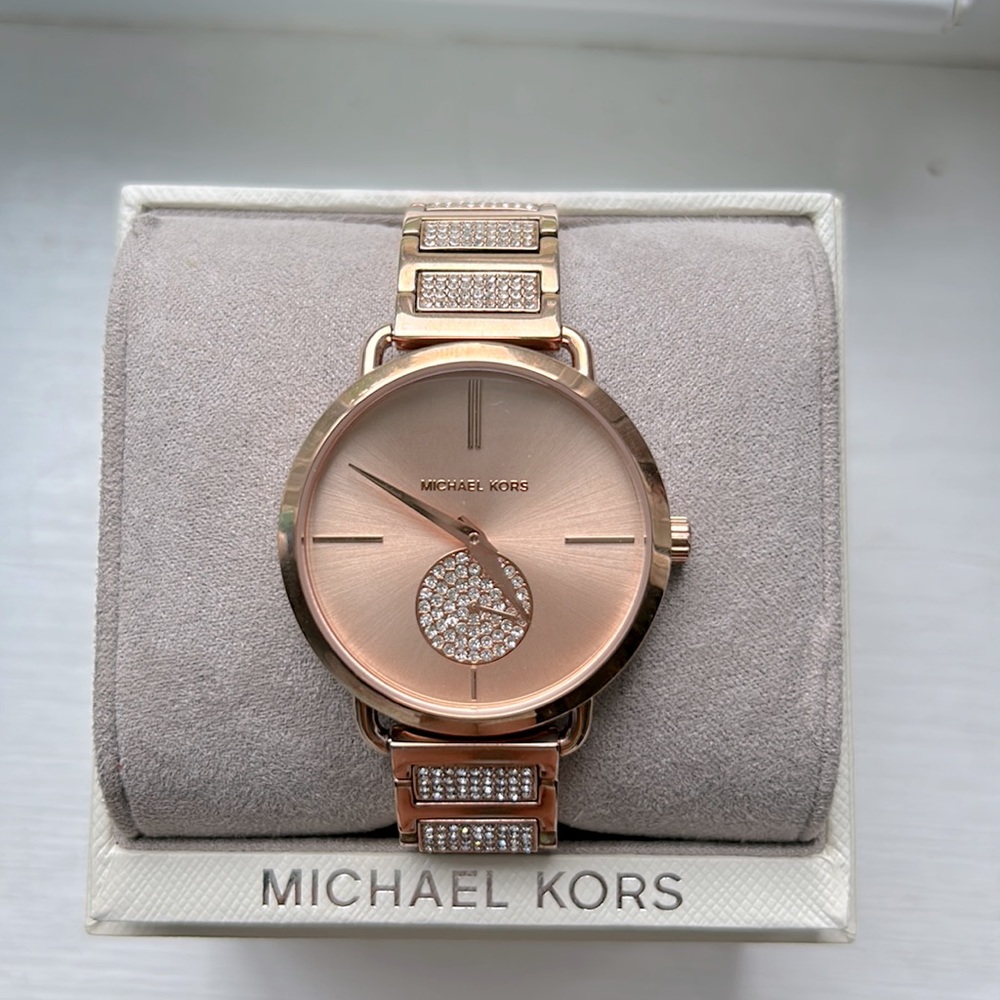 Never worn Rose Gold Michael Kors watch.